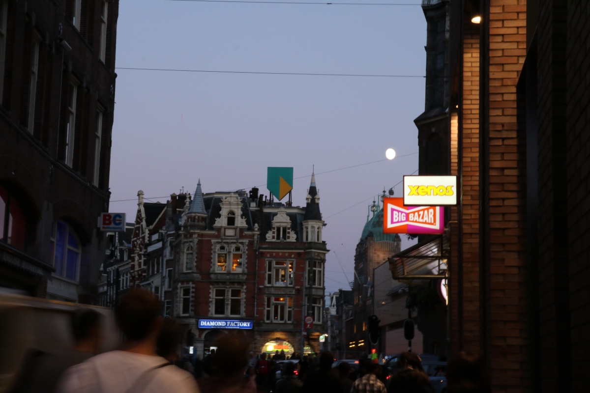 Explore the crowded streets at night.                    